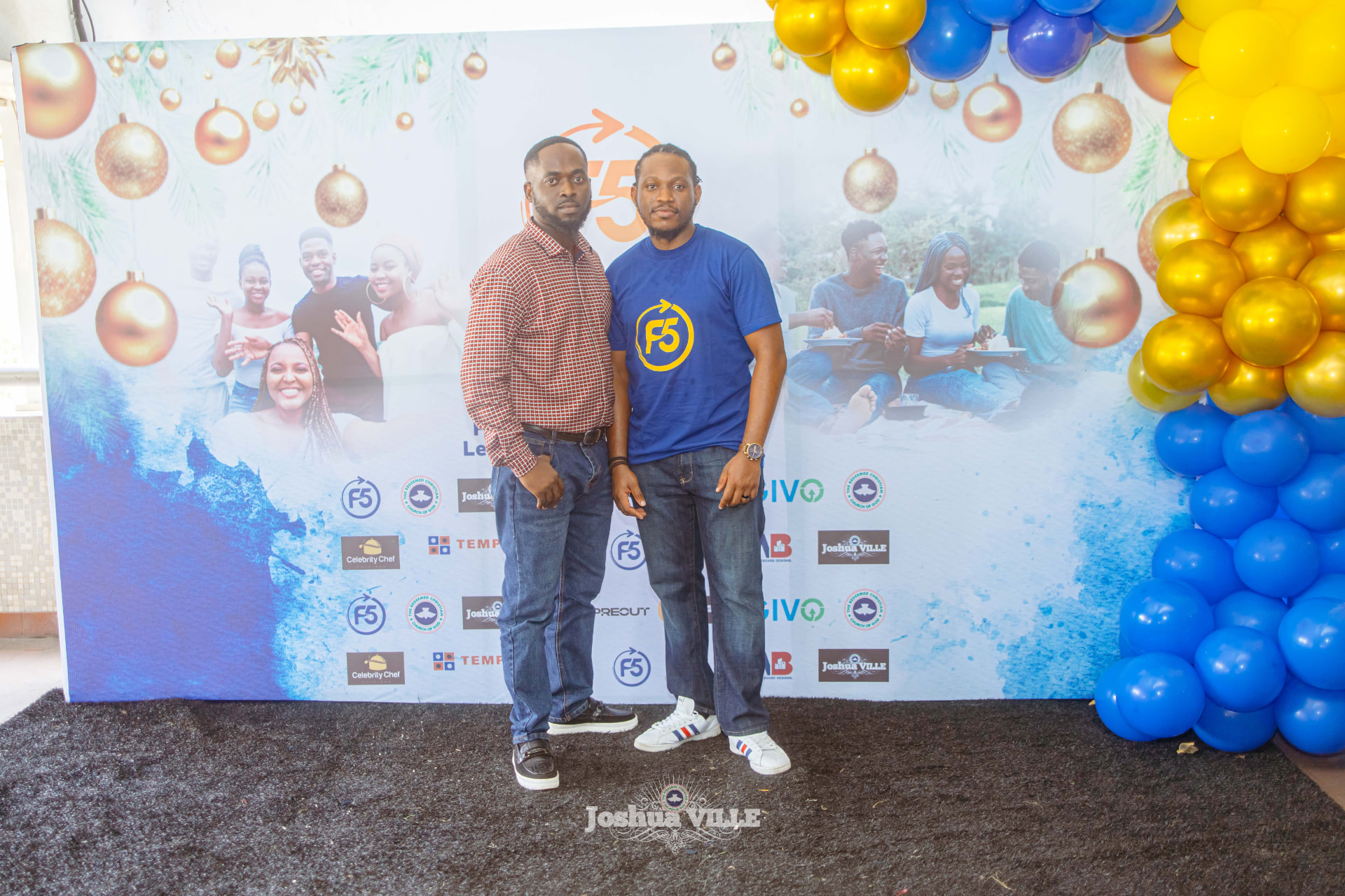 Two guests at the F5 Hangout photo backdrop