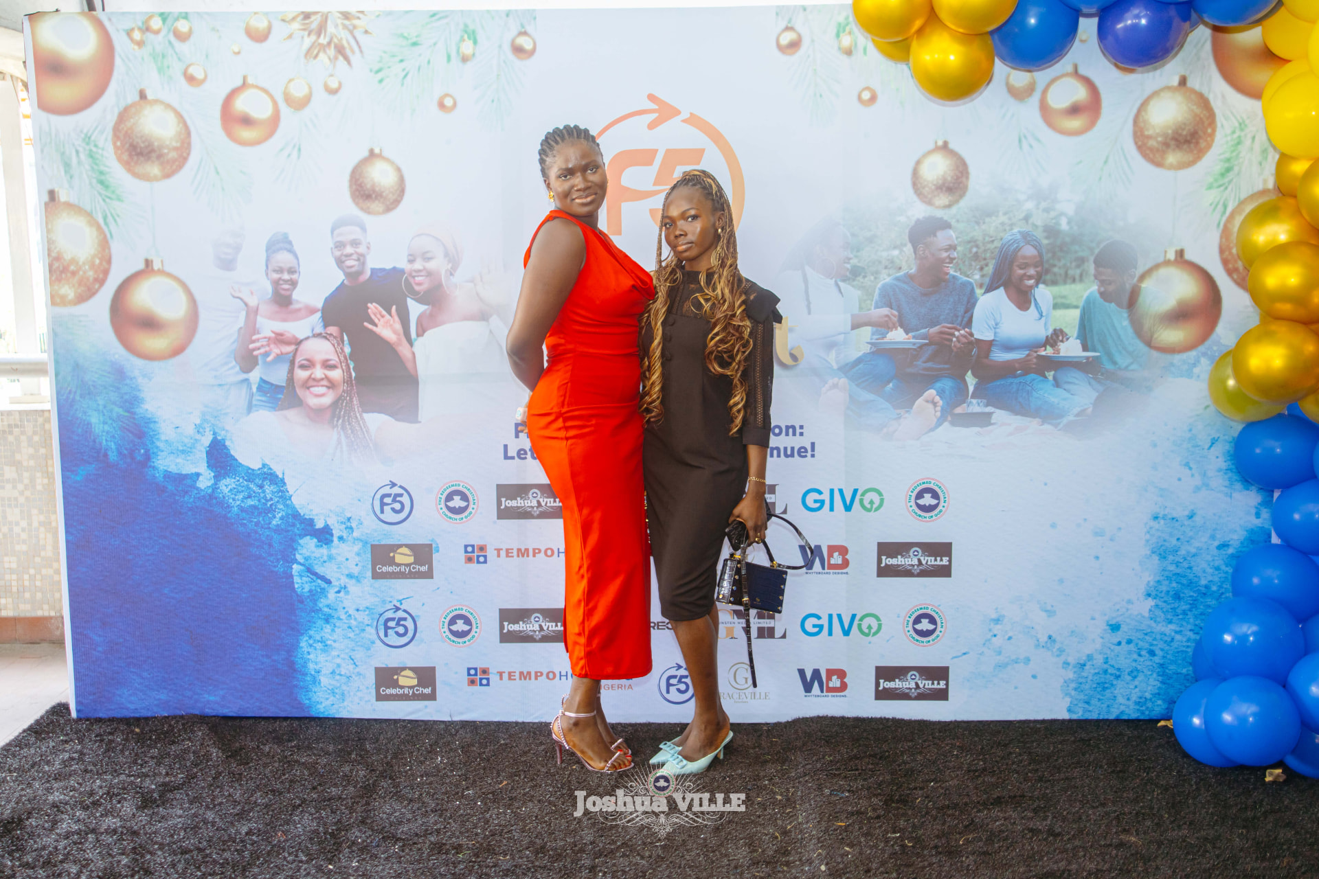 Friends posing at the F5 Hangout backdrop